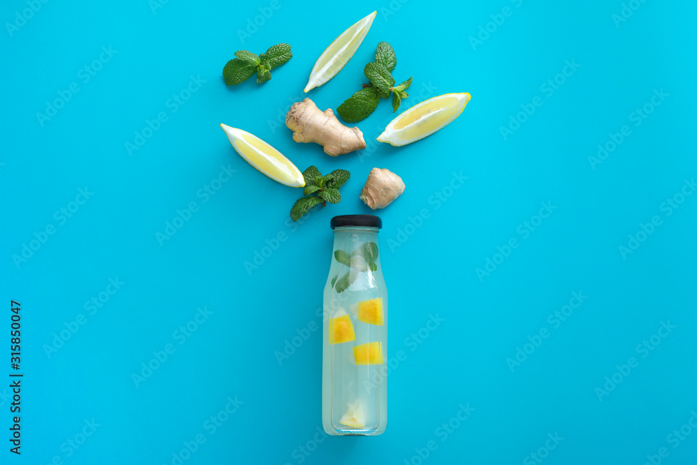 Composition with tasty ginger lemonade on color background