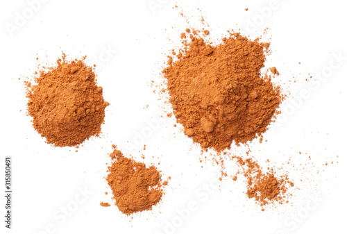 Cuadros en Lienzo Cinnamon Powder Piles Isolated On White Background