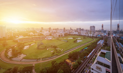 Wall Mural - City view of green stadium field of horserunner in the Bangkok Sports Club.