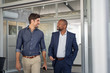 © Rido - Business people discussing in modern office