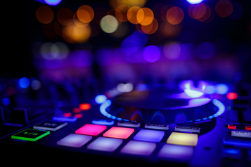 Wall Mural - closeup view of a DJ's mixing desk