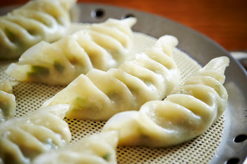 Poster - Steamed Chinese dumpling on steamer 