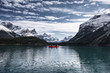 Traveler canoeing on Maligne lake with Canadian rockies in Spirit Island at Jasper national park