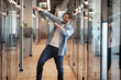 canvas print picture - Funny happy male employee dance in office celebrating