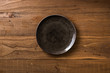 Brown Plate on brown wooden background