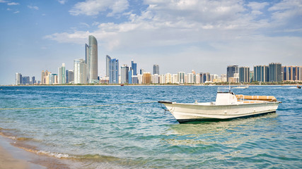 Motor boat with Abu Dhabi skyline at the background