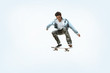 © master1305 - Caucasian young skateboarder riding isolated on a white studio background. Man in casual clothing training, jumping, practicing in motion. Concept of hobby, healthy lifestyle, youth, action, movement.