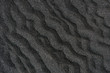 Pattern of black sand, diagonal waves, top view