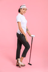 Wall Mural - Beautiful female golfer on color background