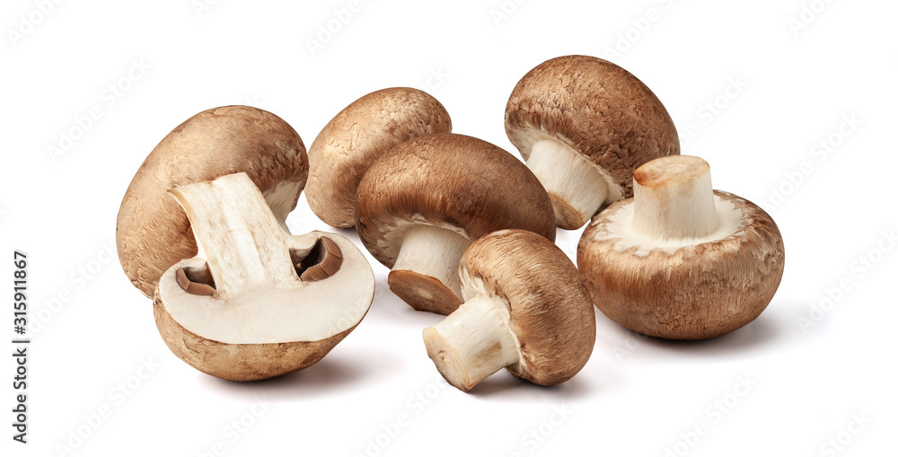 Two fresh mushrooms champignons, one whole and the other cut in half isolated on white background with clipping path - obrazy, fototapety, plakaty 