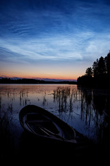 Wall Mural - night shining clouds over lake