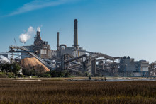 Paper Mill Over Marsh Wetlands In Fernandina Beach Florida. 