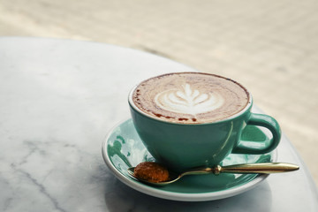 Wall Mural - A cup of coffee with latte art on top