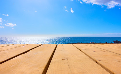 Wall Mural - wooden table and blue sea