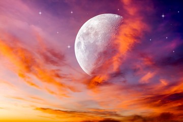 Wall Mural - moon in bright clouds of sunset sun . new moon . the sky at night with stars.