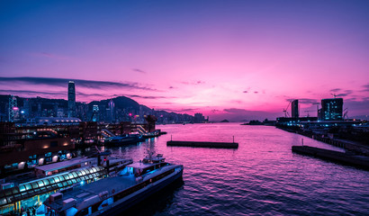 Canvas Print - Victoria Harbour and HongKong skyline with sunset sky -