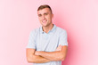 © Asier - Young caucasian man isolated who feels confident, crossing arms with determination.