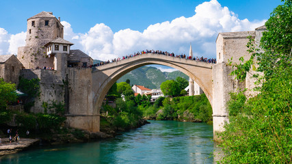 Mostar, Bosnia and Herzegovina, April 2019: Old town and Neretva River. The town was destroyed during the Croat-Bosniak war in 1993, reconstructed and now a UNESCO World Heritage