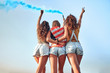 © HBS - Group of girls with American flag. Young female friends with USA flag at park celebrating 4th of july.