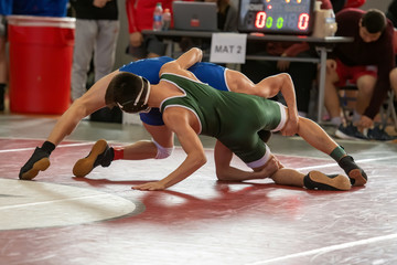 High School wrestlers competing at a wrestling meet