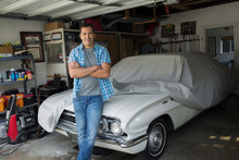 Portrait Man Leaning On Covered Vintage Car Garage