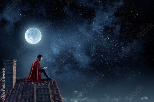 Fotomural Super hero on roof. Mixed media
