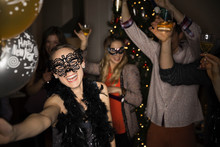 Woman In Masquerade Mask Enjoying New Years Eve Party