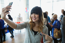 Smiling Young Woman Taking Selfie Voter Polling Place
