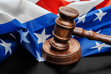 Judge gavel on the background of the flag united states of America