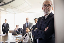 Serious Attentive Male Lawyer Listening In Conference Room Meeting