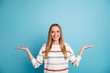 Photo of blonde haired cheerful toothy beaming woman holding two sides of one option for you to estimate isolated empty space pastel color background