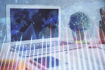 Forex market chart hologram and personal computer background. Double exposure. Concept of investment.