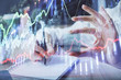 © peshkova - Forex chart displayed on woman's hand taking notes background. Concept of research. Multi exposure