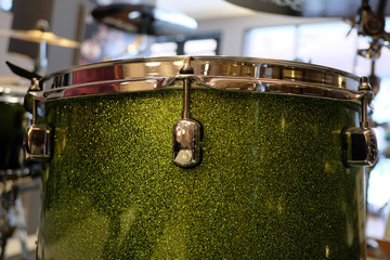 Close up of Green Drumset is it a instruments for drummer musician, percussion rythm equipment. with selective focus