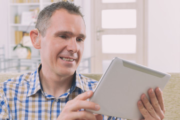 Wall Mural - Deaf man using sign language on the tablet