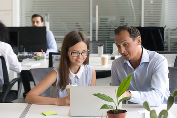 Sticker - Diverse colleagues work on laptop in shared office