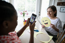 Tween Girl With Camera Phone Photographing Friend Holding Winking Emoji Art Project