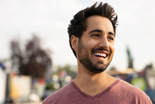 Portrait Smiling, Carefree Young Man Looking Away