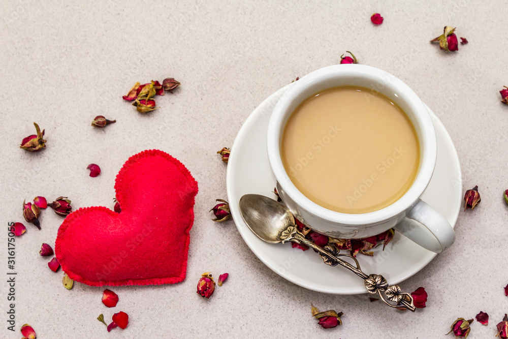Good morning. Cup of coffee, rose buds and petals, red felt heart ...