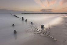 Soft Waterscape With Stick On Foreground, Made On Long Exposure Shutter.