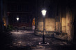 Rainy night in old European city with lanterns
