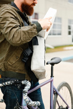 Courier With Package And Bicycle