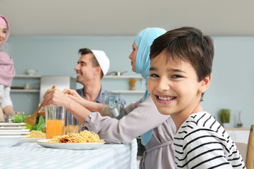 Wall Mural - Muslim family having dinner at home