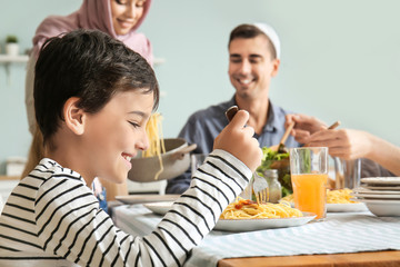 Canvas Print - Muslim family having dinner at home