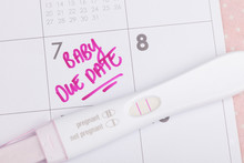 Pregnancy Test And Due Date Marked On Calendar 