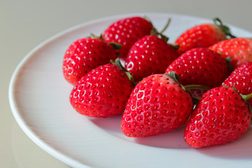 Wall Mural - group of strawberries on white dish