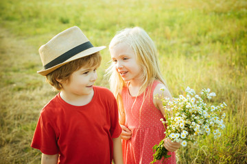 Wall Mural - Beautiful little couple - boy and girl embracing. Childhood concept. Summer portrait of happy cute child. Romantic and love. Love concept. First love. Happy Valentines day.