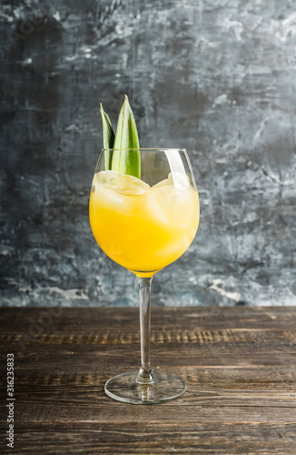 Cuadros en Lienzo Pineapple cocktail in wine glass