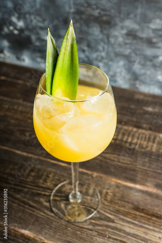 Cuadros en Lienzo Pineapple cocktail in wine glass