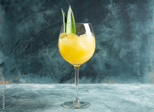 Cuadros en Lienzo Pineapple cocktail in wine glass
